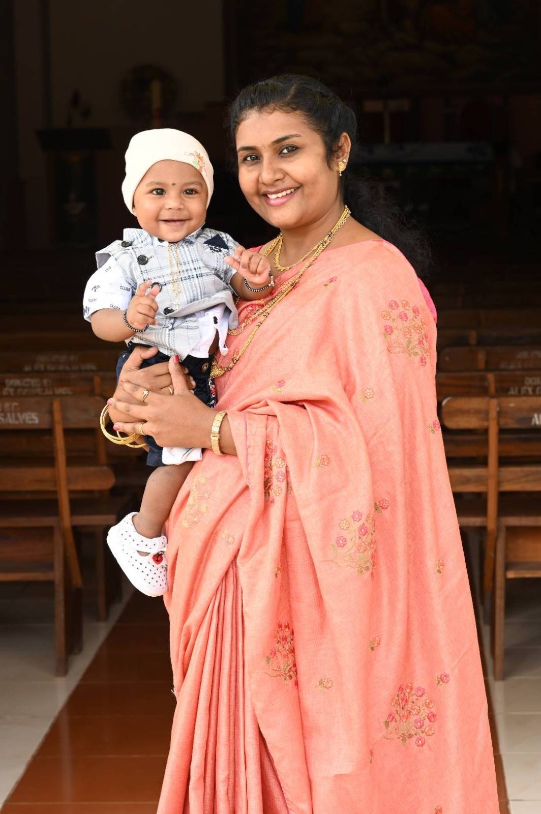 Moovitha holding her child β the heart of the journey